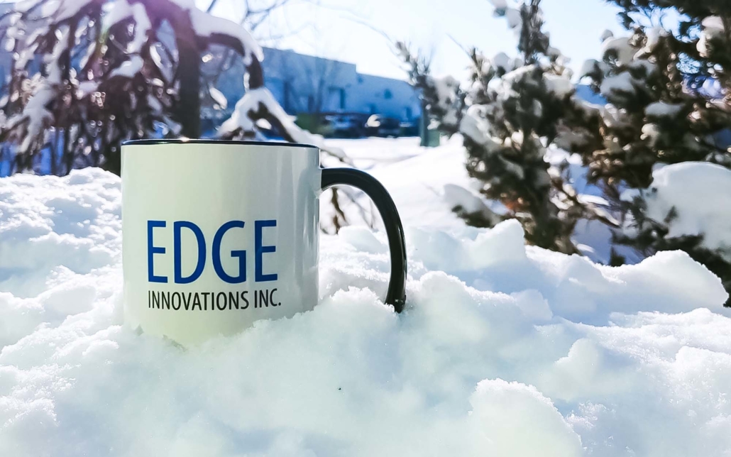 Edge Inc Mug sitting in the snow