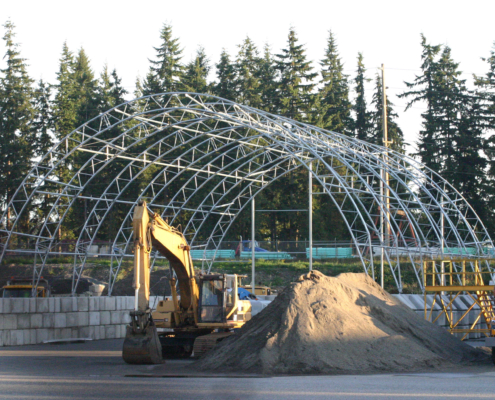 Erecting a fabric structure in an urban environment
